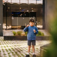 boy blowing bubbles - garden decoration stock pictures, royalty-free photos & images