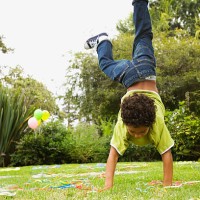 boy doing handstand - garden decoration stock pictures, royalty-free photos & images