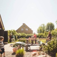 boy looking at grandparents doing carpentry in yard against clear sky - home decoration stock pictures, royalty-free photos & images