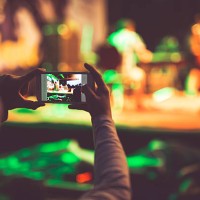 boy photographing event with mobile phone - concert stock pictures, royalty-free photos & images