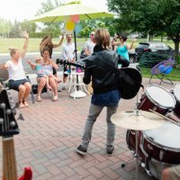 boy's band in concert in family driveway in summer. - concert stock pictures, royalty-free photos & images