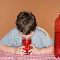 boy smelling fizzy drink - junk food stock pictures, royalty-free photos & images