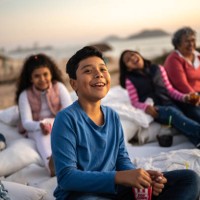 boy watching a film at the outdoors cinema - concert stock pictures, royalty-free photos & images