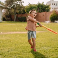 boys hiting a piñata at a party - garden decoration stock pictures, royalty-free photos & images