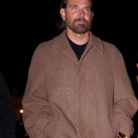 Bradley Cooper wears a brown long winter coat, before the Louis Vuitton Menswear Fall-Winter 2025/2026 show as part of Paris Fashion Week on January...