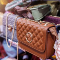brand new designer handbags on shelves of a fashion store for sale. - fashion stock pictures, royalty-free photos & images
