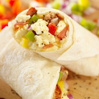 breakfast burrito with scrambled eggs - junk food stock pictures, royalty-free photos & images