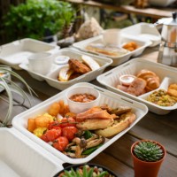 breakfast in a paper to-go box. - junk food stock pictures, royalty-free photos & images
