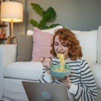 breakfast with multitasking - virtual socializing and a favorite meal - junk food stock pictures, royalty-free photos & images