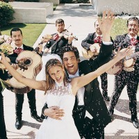 bride and groom celebrate with confetti and a mariachi band on a garden path - garden decoration stockfoto's en -beelden