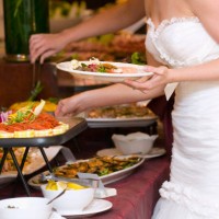 bride getting food from buffet. - food stock pictures, royalty-free photos & images