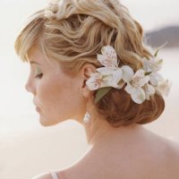bride wearing flowers in hair - hairstyle stock pictures, royalty-free photos & images