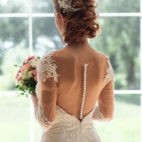 bride with bouquet by window - hairstyle stock pictures, royalty-free photos & images