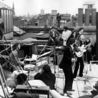 British rock group the Beatles performing their last live public concert on the rooftop of the Apple Organization building for director Michael...