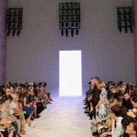 Brooklyn Beckham, David Beckham, and Anna Wintour stand for a moment of silence honoring the victims of the 9/11/2001 terrorist attacks before the...