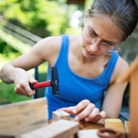 brother and sister crafting fun stuff using pieces of wood - nails art stock pictures, royalty-free photos & images