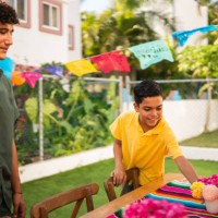 brothers talking and preparing house to party - garden decoration stock pictures, royalty-free photos & images