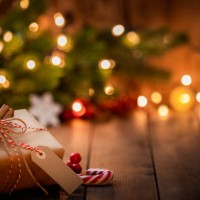 brown christmas gift box with a blank tag on rustic wooden table. - food stock pictures, royalty-free photos & images