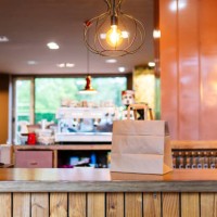 brown paper bag kept on restaurant counter - junk food stock pictures, royalty-free photos & images