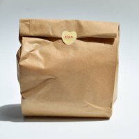 brown paper bag, lunch bag with a cute heart sticker - junk food stock pictures, royalty-free photos & images