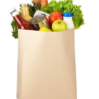 brown paper shopping bag full of groceries on white backdrop - food stock pictures, royalty-free photos & images