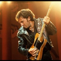 Bruce Springsteen performs on stage at an Amnesty International concert at Wembley Stadium, London, 2nd September 1988.