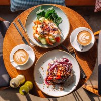 brunch with sweet pancakes and eggs benedict with salmon served in restaurant - food stock pictures, royalty-free photos & images
