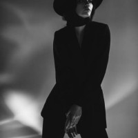 brunette woman in black suit and hat in studio. retro style - fashion stock pictures, royalty-free photos & images