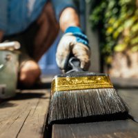 brush and organic oil for saving thewooden deck outdoor. - home decoration stock pictures, royalty-free photos & images
