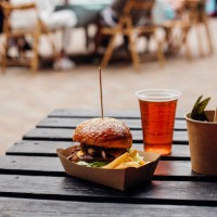 burger on a wooden table outdoor - food stock pictures, royalty-free photos & images