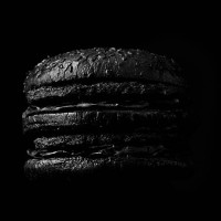 burger on black backdrop - junk food stock pictures, royalty-free photos & images