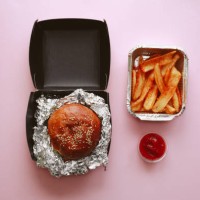 burger with french fries and ketchup in paper boxes over pink background, concept of takeaway food and food delivery. - junk food stock pictures, royalty-free photos & images