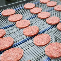 burgers on conveyor - food stock pictures, royalty-free photos & images