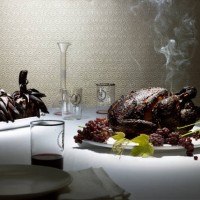 burnt chicken & artichokes on a nice dining table - food stock pictures, royalty-free photos & images