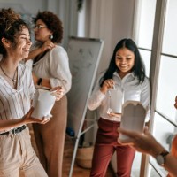 business colleagues having fun during lunch break at office - junk food stock pictures, royalty-free photos & images
