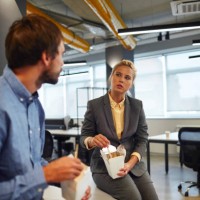 business people eating in their office - junk food stock pictures, royalty-free photos & images