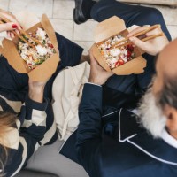 business people taking a break and eating poke with take out box - junk food stock pictures, royalty-free photos & images