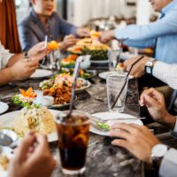 business professionals at a restaurant having dinner - food stock pictures, royalty-free photos & images