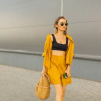 business woman with smartphone in yellow suit. lifestyle. shopping. blonde hair. bag - fashion stock pictures, royalty-free photos & images