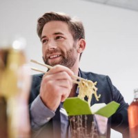 businessman having lunch break with asian food - junk food stock pictures, royalty-free photos & images