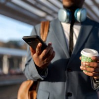 businessman using his phone - junk food stock pictures, royalty-free photos & images