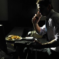 businessman using phone, take away meal on desk, night - junk food stock pictures, royalty-free photos & images