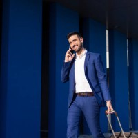 businessman with suitcase taking a business trip - fashion stock pictures, royalty-free photos & images