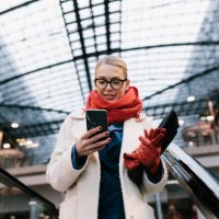 businesswoman texting on way to the office - travel stock pictures, royalty-free photos & images