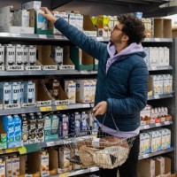 buying vegan alternative milk - food stock pictures, royalty-free photos & images