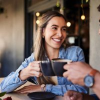 cafe, couple date cheers and woman smile in a coffee shop with a man feeling love and happiness. restaurant, discussion and happy people out for lunch talking about relationship with morning drink - coffee stock pictures, roy