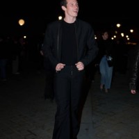 Callum Turner wears a bomber jacket , a black t-shirt, before the Louis Vuitton Menswear Fall-Winter 2025/2026 show as part of Paris Fashion Week on...