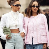 Camila Coelho wears mint green jeans, white turtleneck cropped top, white jacket, green bag and sunglasses and Aimee Song wears blue jeans, pink...