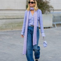 Candela Pelizza wears lavender jacket, scarf, boyfriend style jeans outside Chanel during Womenswear Spring/Summer 2025 as part of Paris Fashion Week...