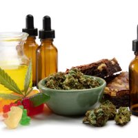 cannabis oils and bud in a small bowl surrounded by sweet edibles - food stock pictures, royalty-free photos & images